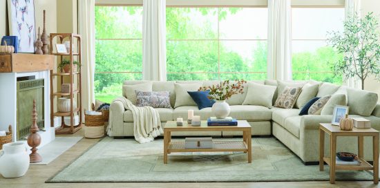 A cozy living room with autumn-themed decor featuring both cool and warm colors. 