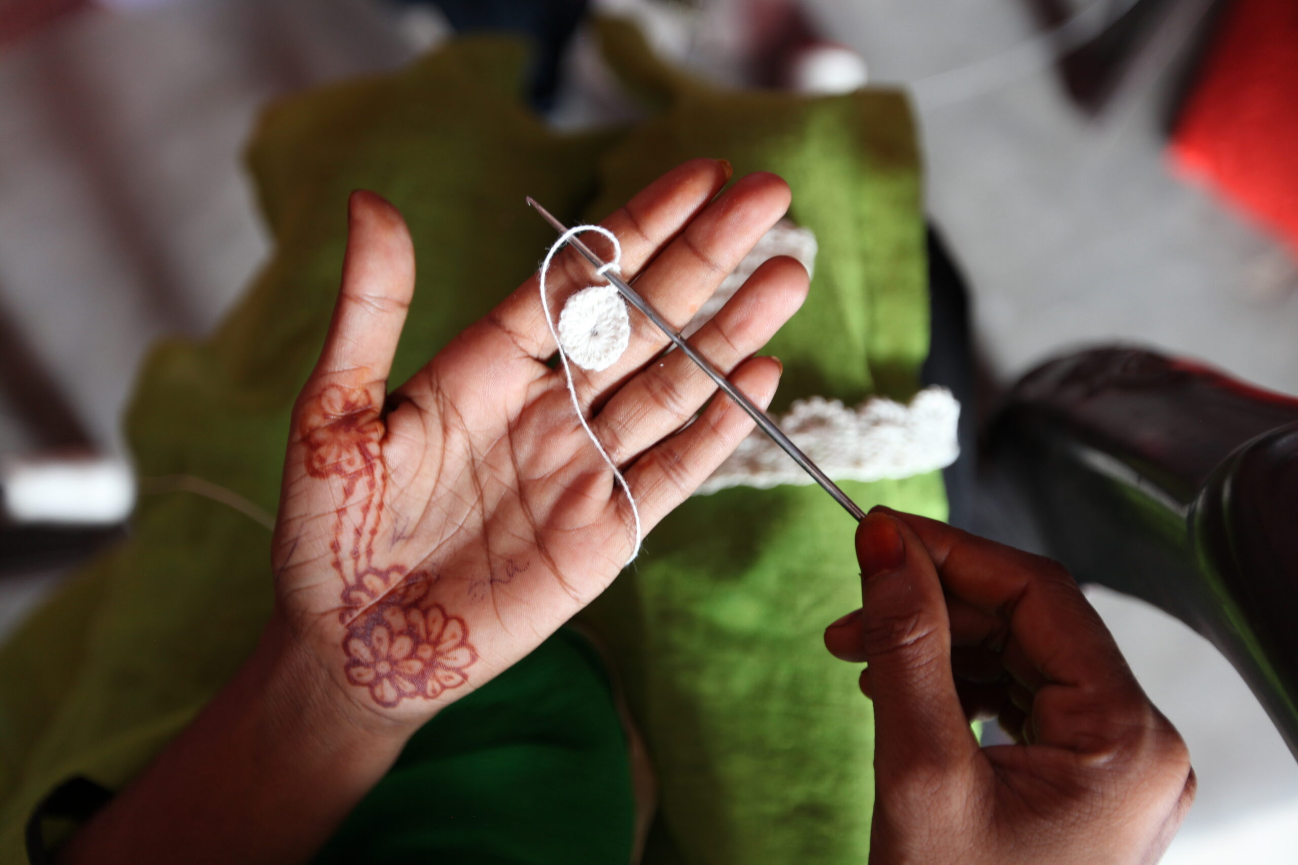 The word crochet comes from a French term meaning "little hook" and the technique is used to create decorative accessories or garments. One of our artisan partners outside of Delhi, India, shows us the beginning stages of a piece she is working on.